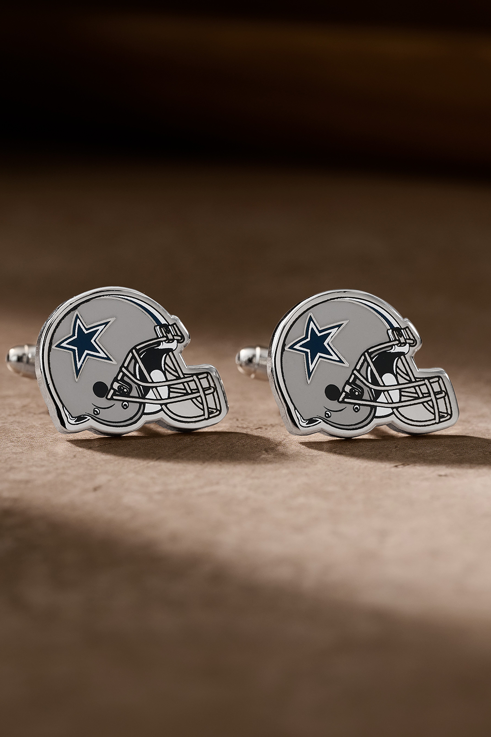 Dallas Cowboys Helmet Cufflinks on a table